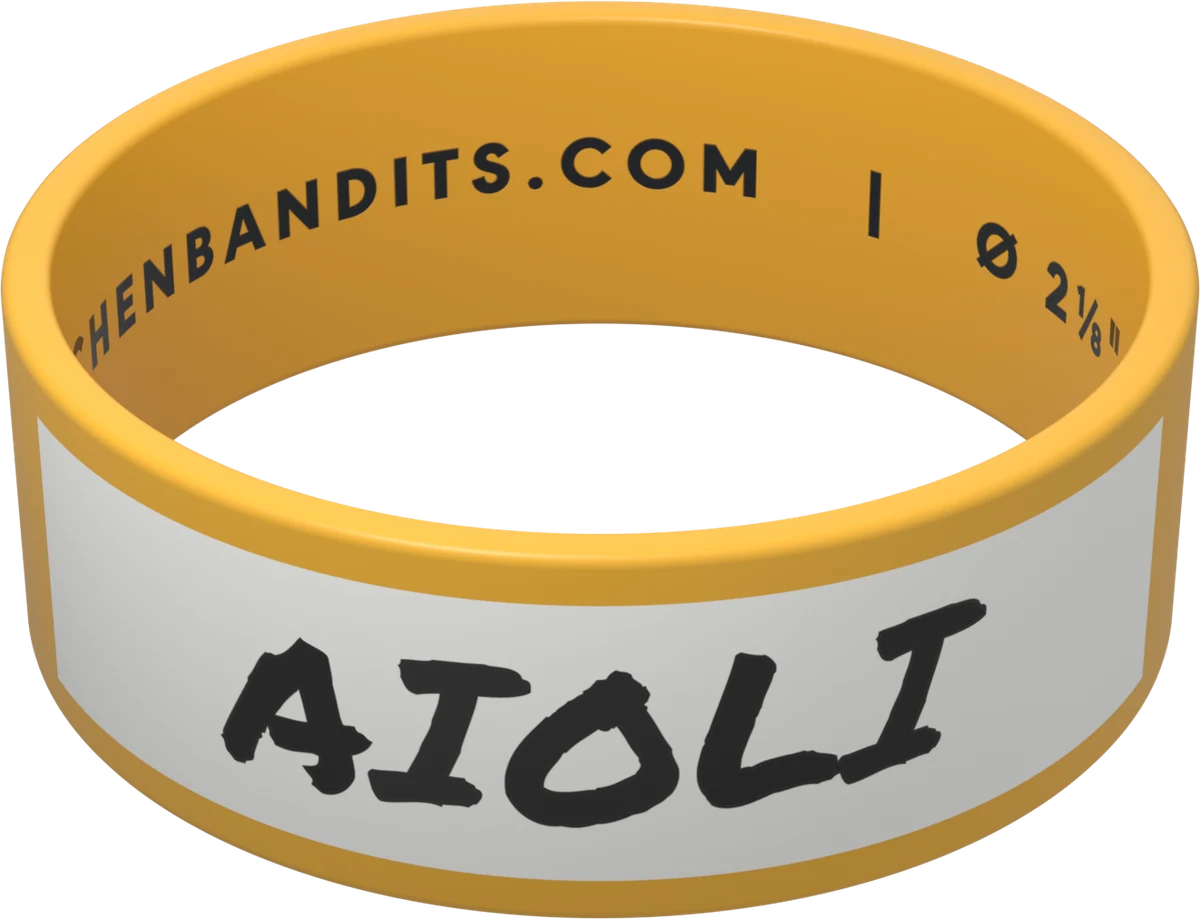 Yellow Kitchen Bandits silicone bottle band, hand-labeled in marker