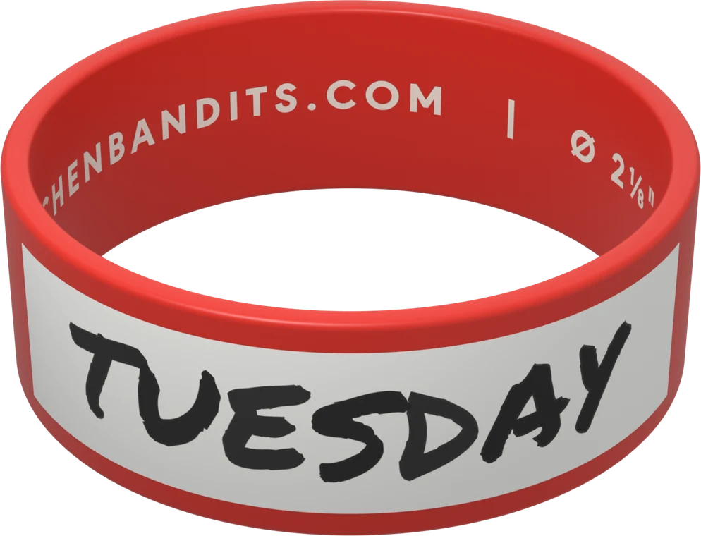 A red 2 1/8-inch Kitchen Bandits band, its white writing box hand-labeled TUESDAY in marker