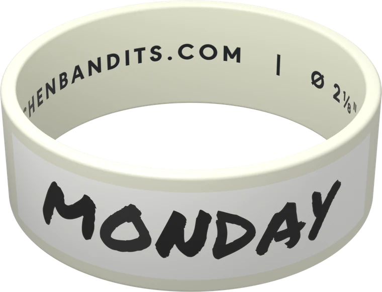 A white Kitchen Bandits band labelled MONDAY, wiping clean to an empty writing box