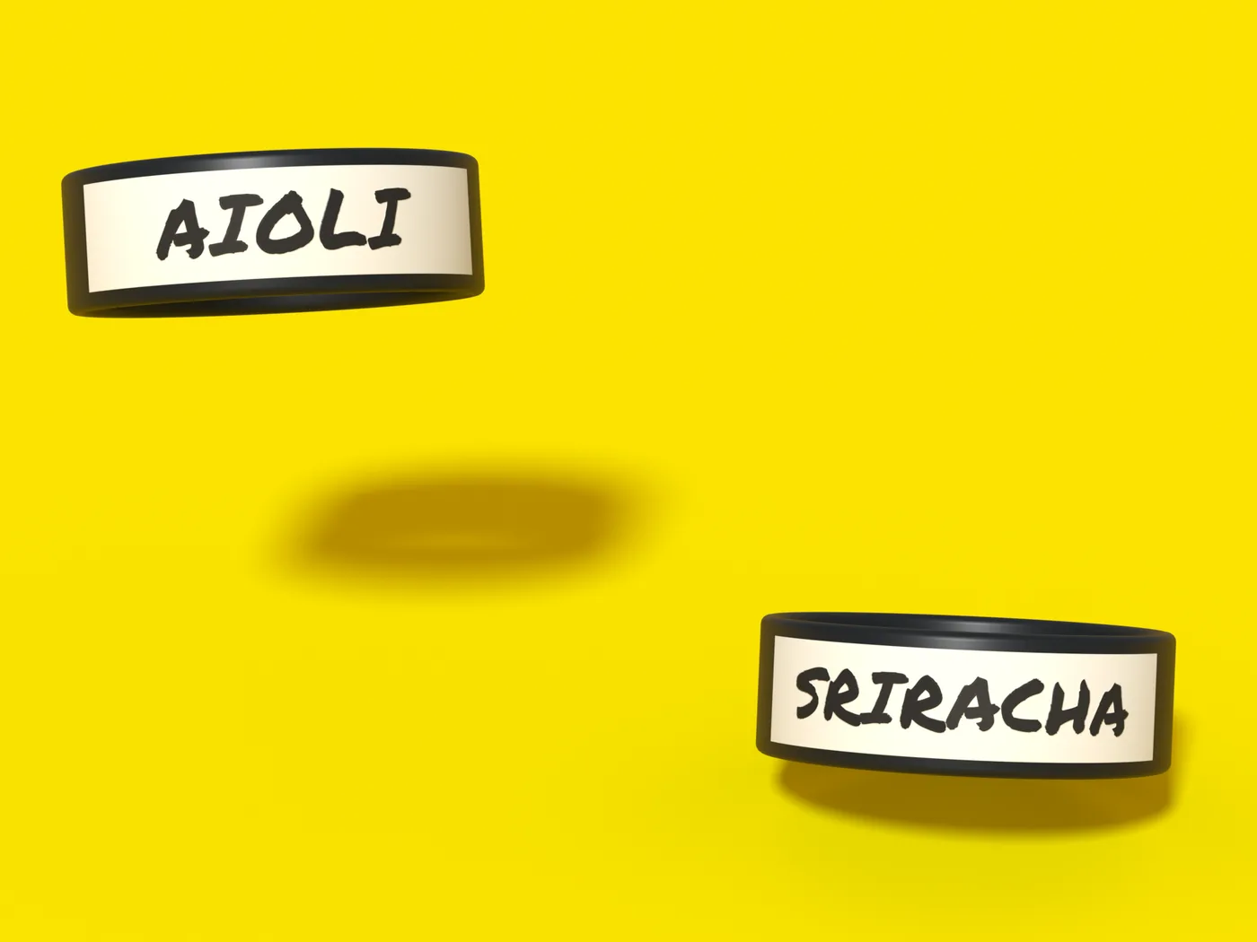 Two black bands floating on yellow, one hand-labeled AIOLI and one relabeled SRIRACHA