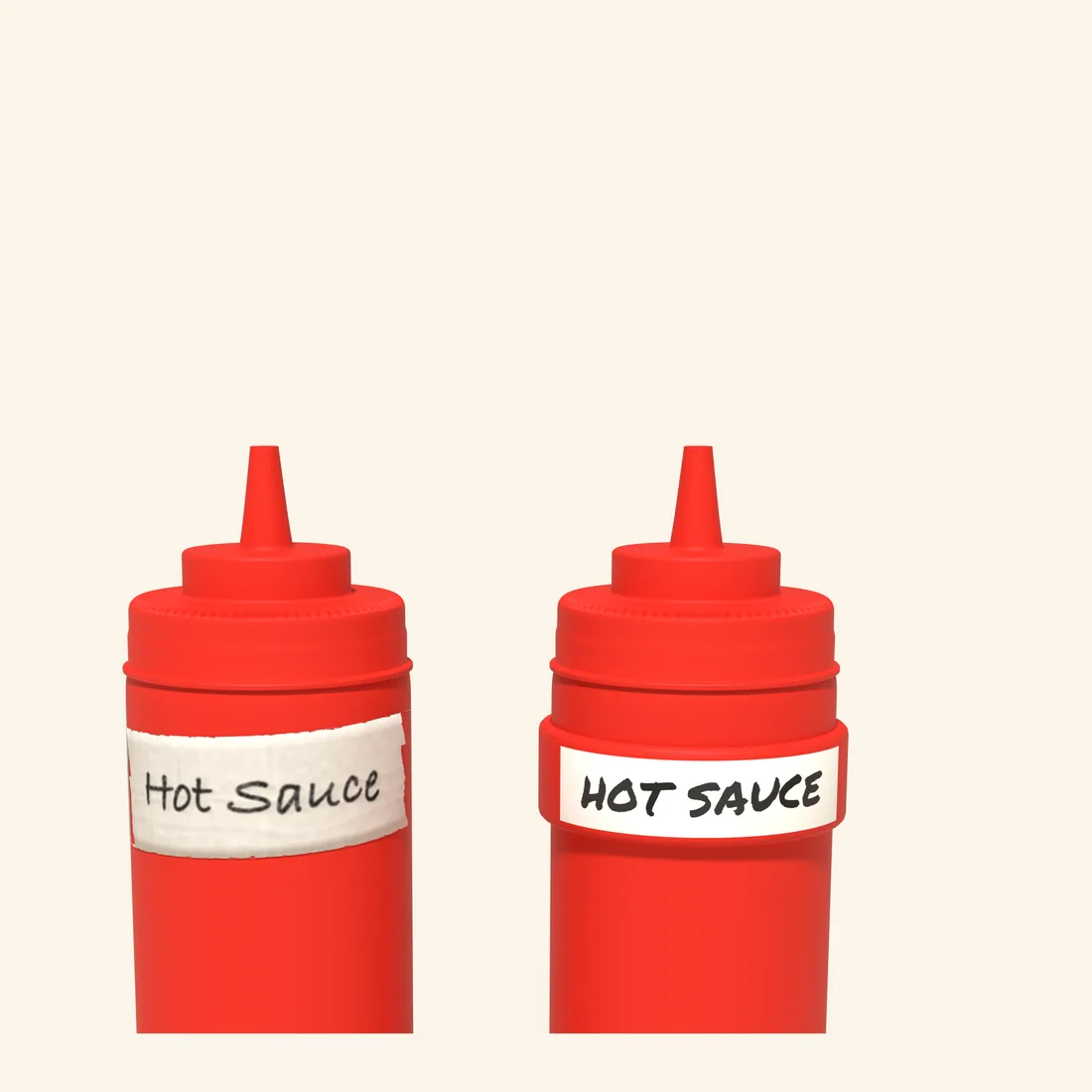 Two red squeeze bottles: the left labeled HOT SAUCE on curling masking tape, the right wearing a red Kitchen Bandits band written HOT SAUCE in marker